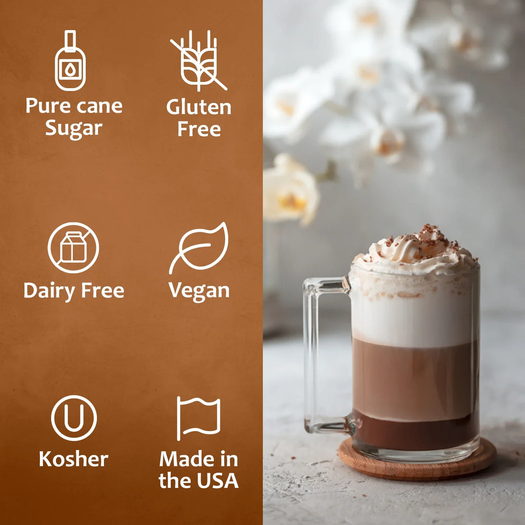 Glass mug of hot chocolate with whipped cream on a wooden coaster, next to a brown background with certification icons.